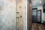 The primary bedroom ensuite offers a walk-in custom tile shower & oversized closet.